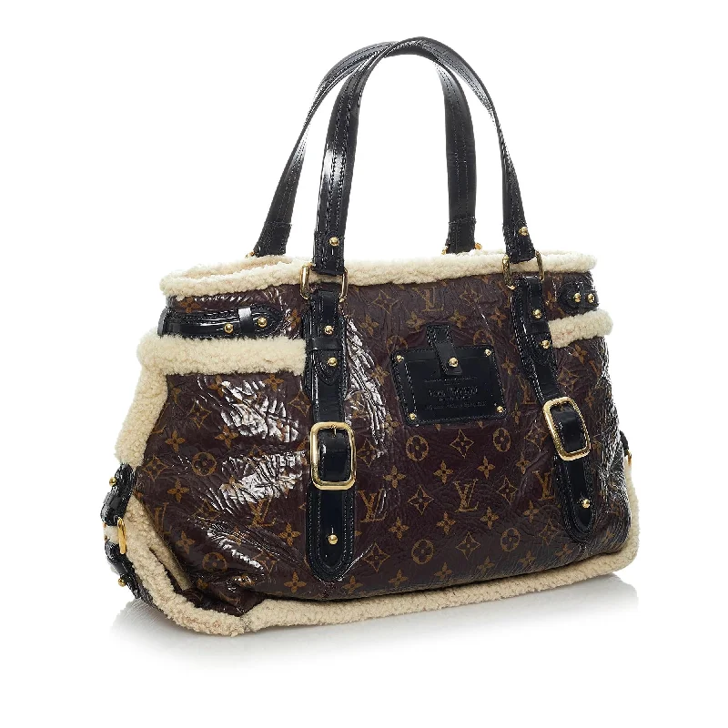 Louis Vuitton Alma bags with a monogram - embossed leather surfaceLouis Vuitton Monogram Shearling Thunder (29408)