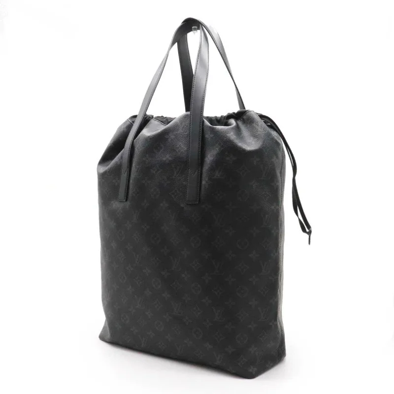 Ladies Louis Vuitton Petite Malle bags with a star - shaped charm for cutenessLouis Vuitton Navy Canvas Eclipse tote bag