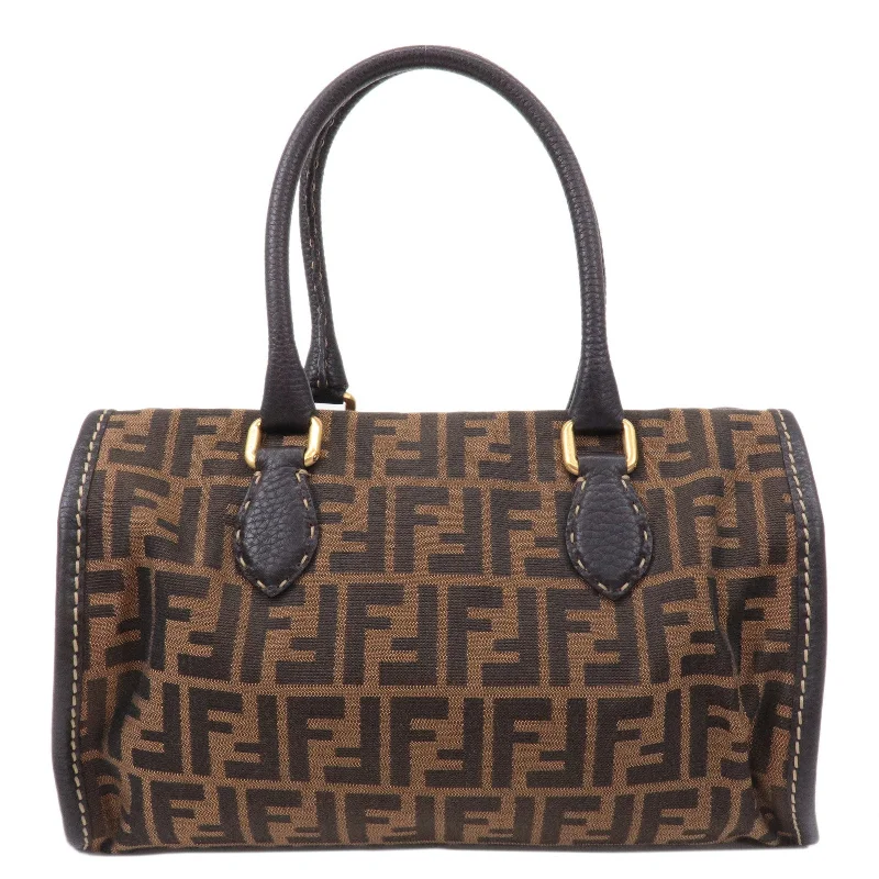 Fendi Baguette bags in a limited - edition colorway for a rare and exclusive lookFENDI Selleria Zucca Canvas Leather Hand Bag Brown Black 8BN218