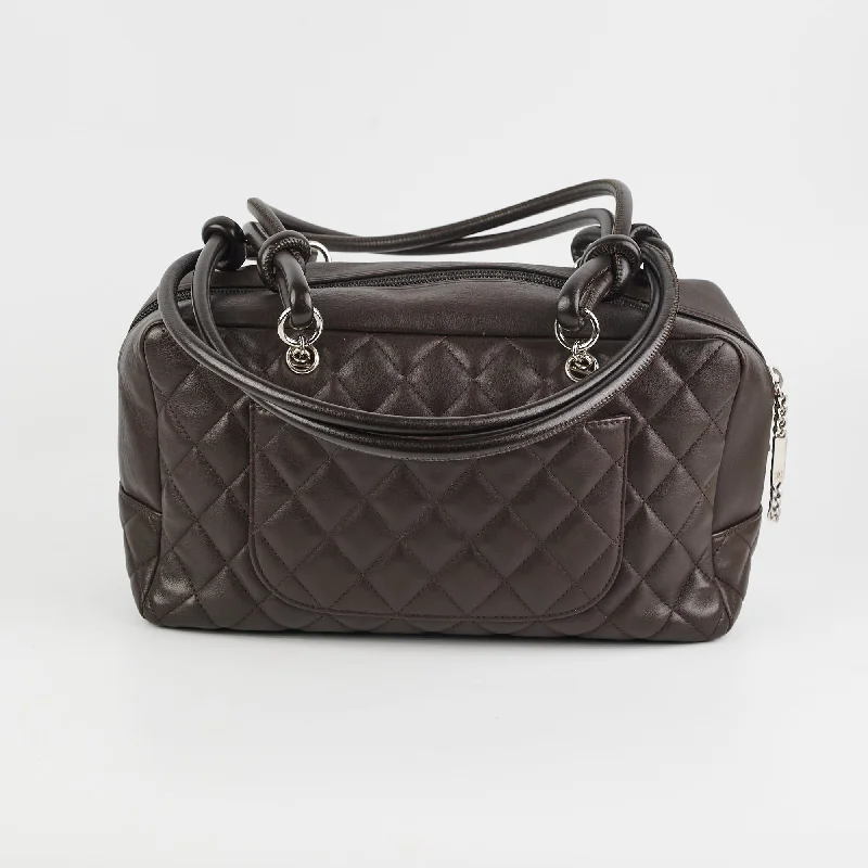 Chanel bags with iconic gold chainsChanel Cambon Bowler Quilted Leather Bag